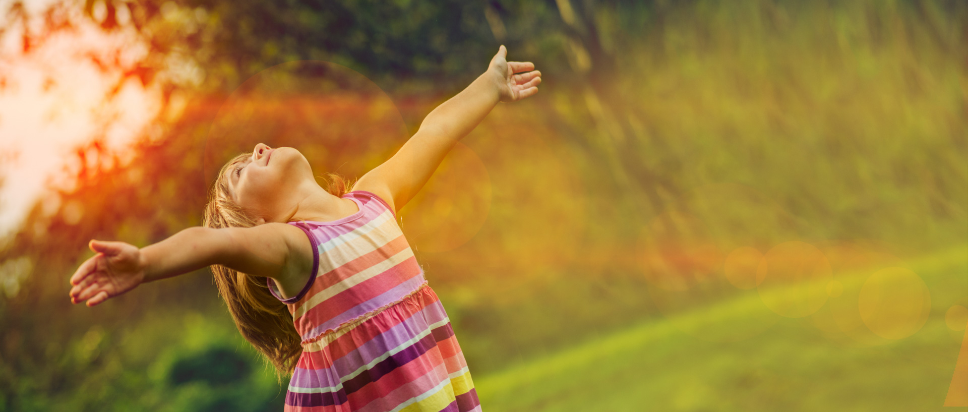 Beautiful girl enjoying the sun with outstretched arms